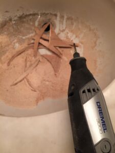 But when the tool had melted through the plastic shell, I had to switch over to cutting it hand held